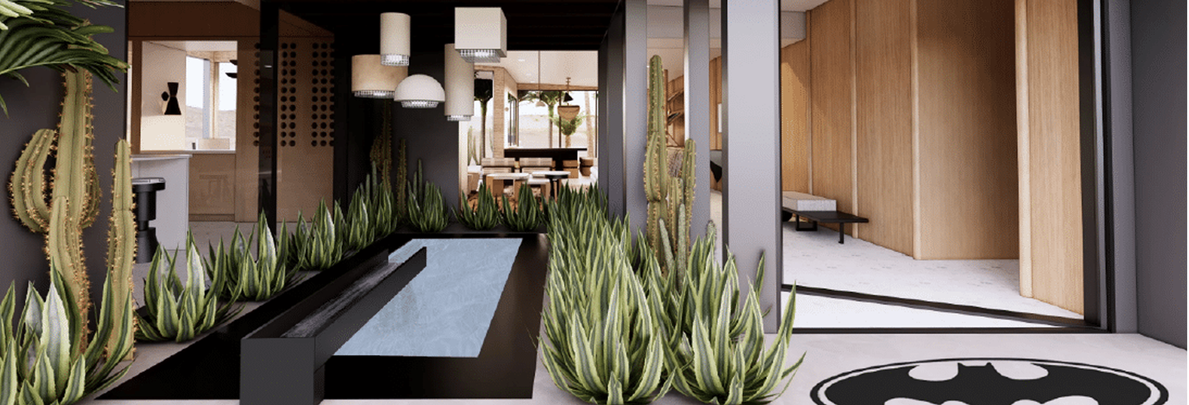 Modern interior courtyard featuring a sleek black reflecting pool surrounded by tall green succulents and cacti, with pendant lighting overhead and open-concept spaces showcasing natural wood walls and minimalist design.