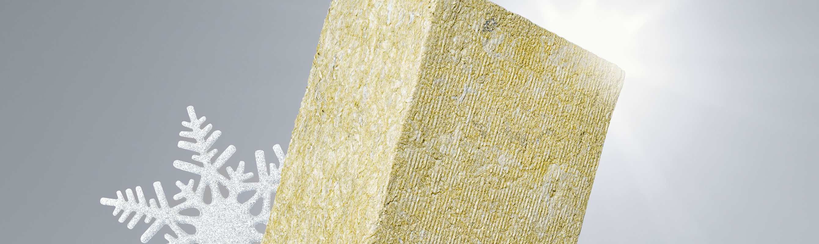 Stone wool insulation material with snowflakes, illustrating its thermal insulation properties.
