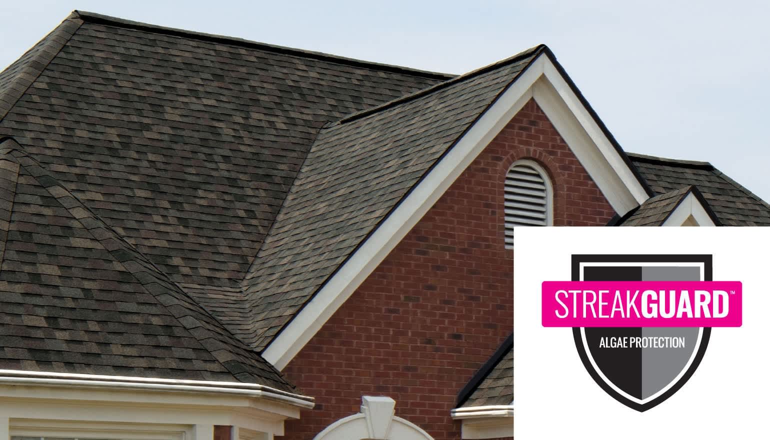 Steep slope roof on a red brick home, and Owens Corning TruDefinition Duration Designer shingles in Black Sable, and the Streakguard logo.