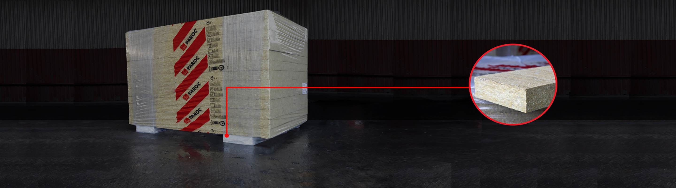 PAROCi kivivillapaneeli pakend, millel on punane joon, mis viib paneeli suurendatud pildile teises otsas.