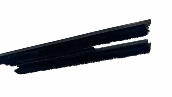 Close-up of a black mohair weather strip system.