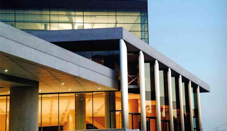Photo of a commercial building at dusk.