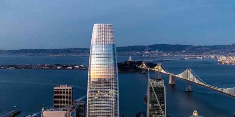 Salesforce tower featuring the of top of building overlooking water
