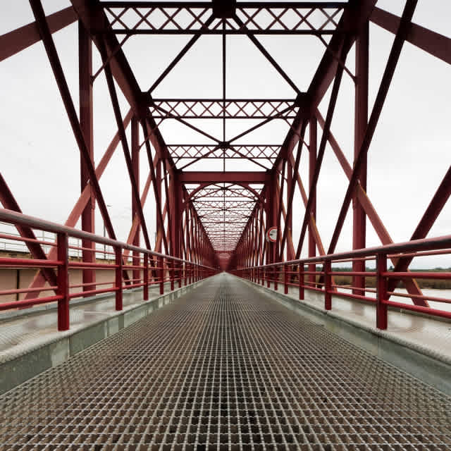 Photo of a red bridge.